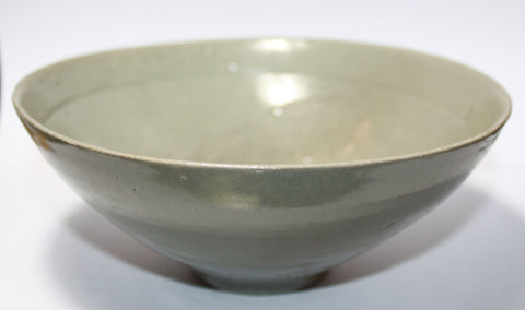 A Korean moulded celadon glazed bowl.