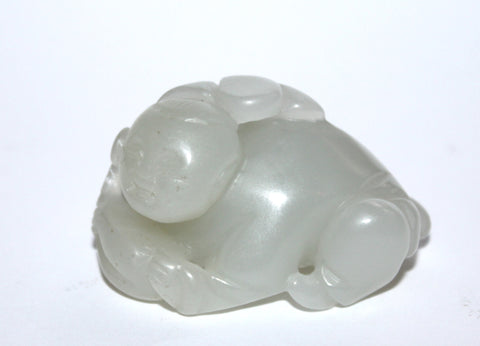 A Chinese jade figure of a boy. 19th Century.