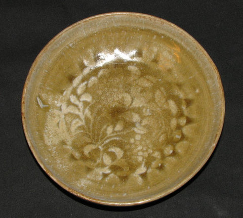 A celadon floral decorated molded dish.