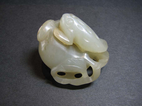 A celadon jade carving of 'toad and pomegranate' group.