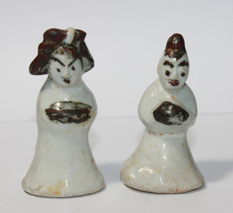 A pair of Korean porcelain miniature figures.