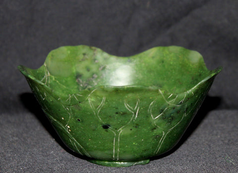 A Chinese spinach green jade cup.