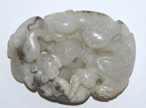 A middle Ming jade dragon pendant.