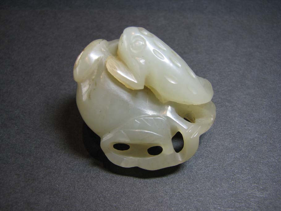 A celadon jade carving of 'toad and pomegranate' group. - asianartlondon