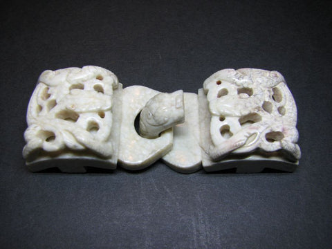 A 'chicken bone' jade belt hook and buckle set.