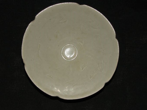 A Qingbai fluted shallow bowl with carved decoration.