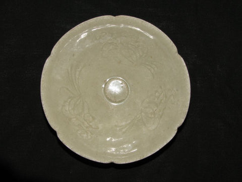 A Qingbai fluted shallow bowl with floral decoration.